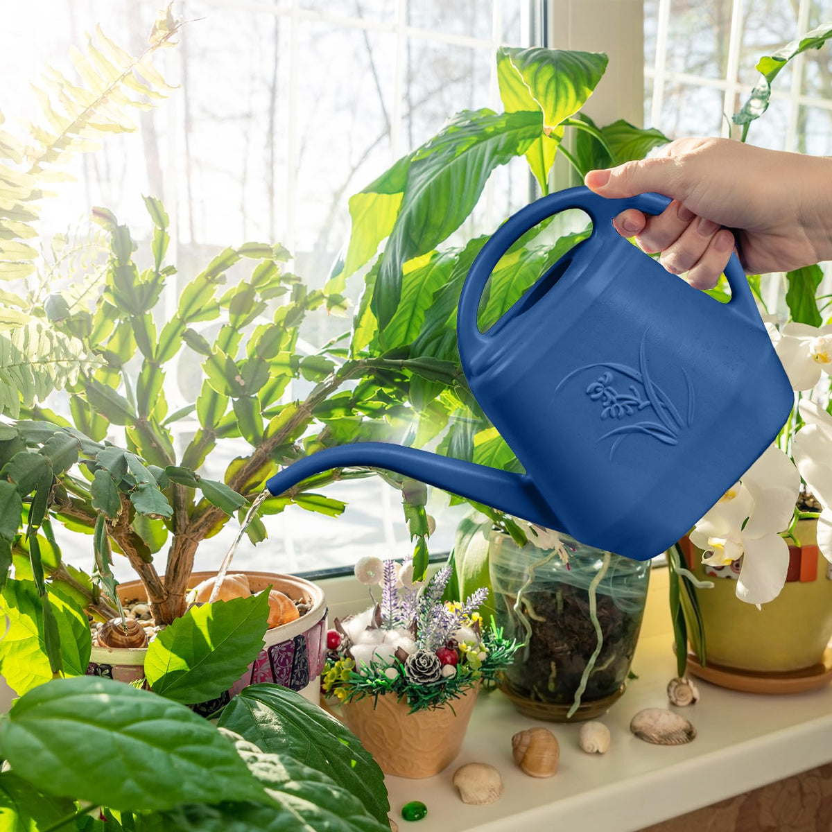 TTAOE GN watering can pictured in a garden setting for versatile plant care.