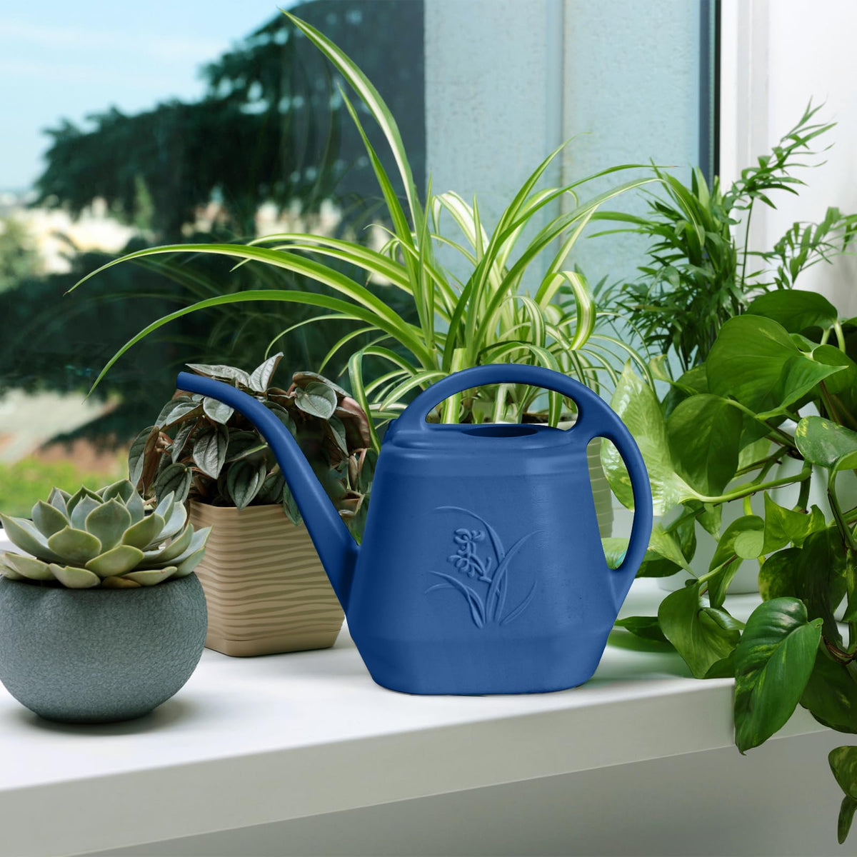 Durable plastic construction of TTAOE GN watering can for everyday gardening.