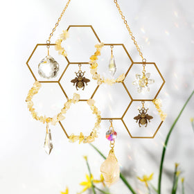 Tuitessine crystal suncatcher with bumble-bee decor creates vivid rainbows in sunlight.