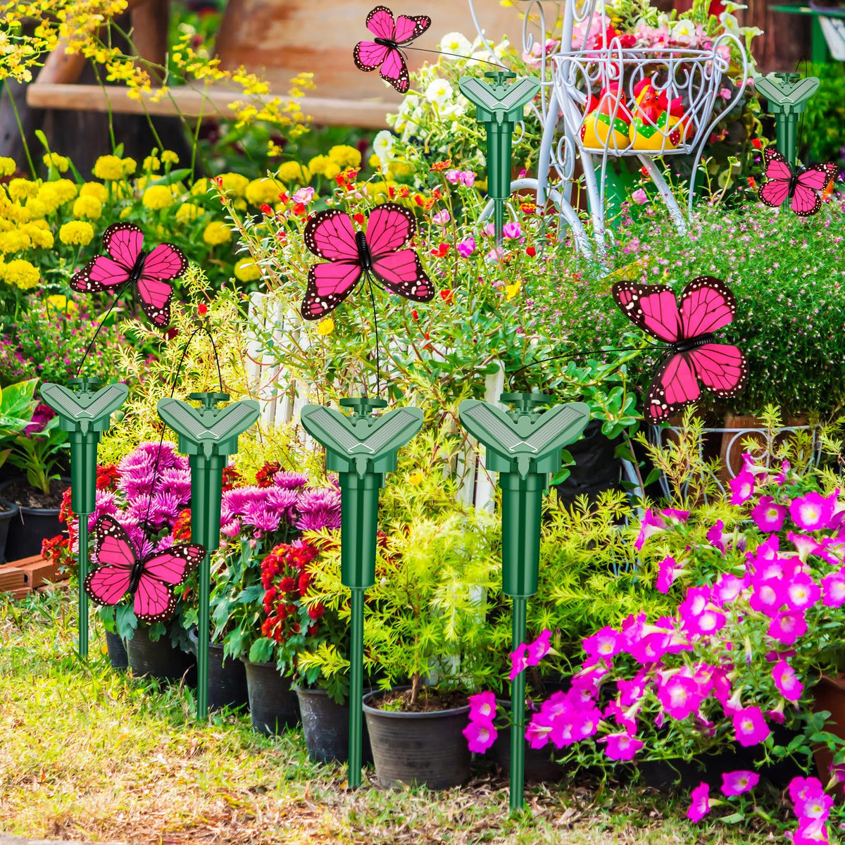 Tujoe 12-pack butterfly yard stakes for quick setup.