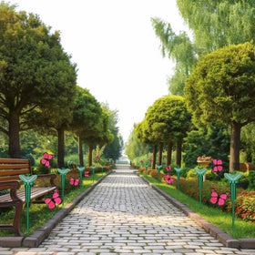 Tujoe fluttering butterfly yard decor enhances flower beds.