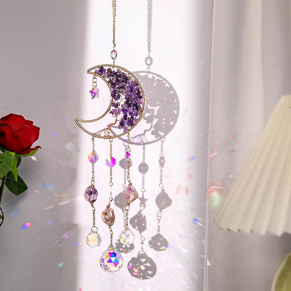 TUOKING amethyst moon suncatcher on a sunny window casting colorful rainbows.