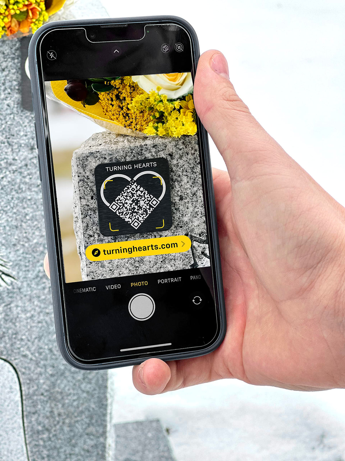 Turning Hearts headstone display with medallion integrating tribute link