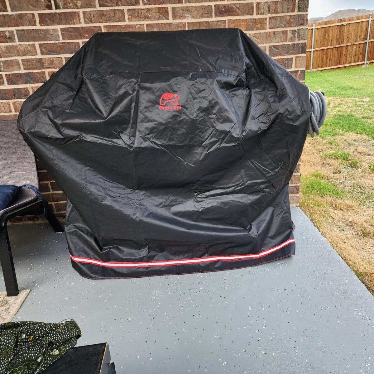 Turtle Life grill cover bottom view reveals convenient storage bag.