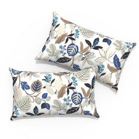 TWLEAR Breeze Leaves Beige outdoor lumbar pillow on a patio chair for all-season comfort