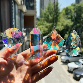 TXXNSM crystal sun catcher ball on window creating vivid rainbow display