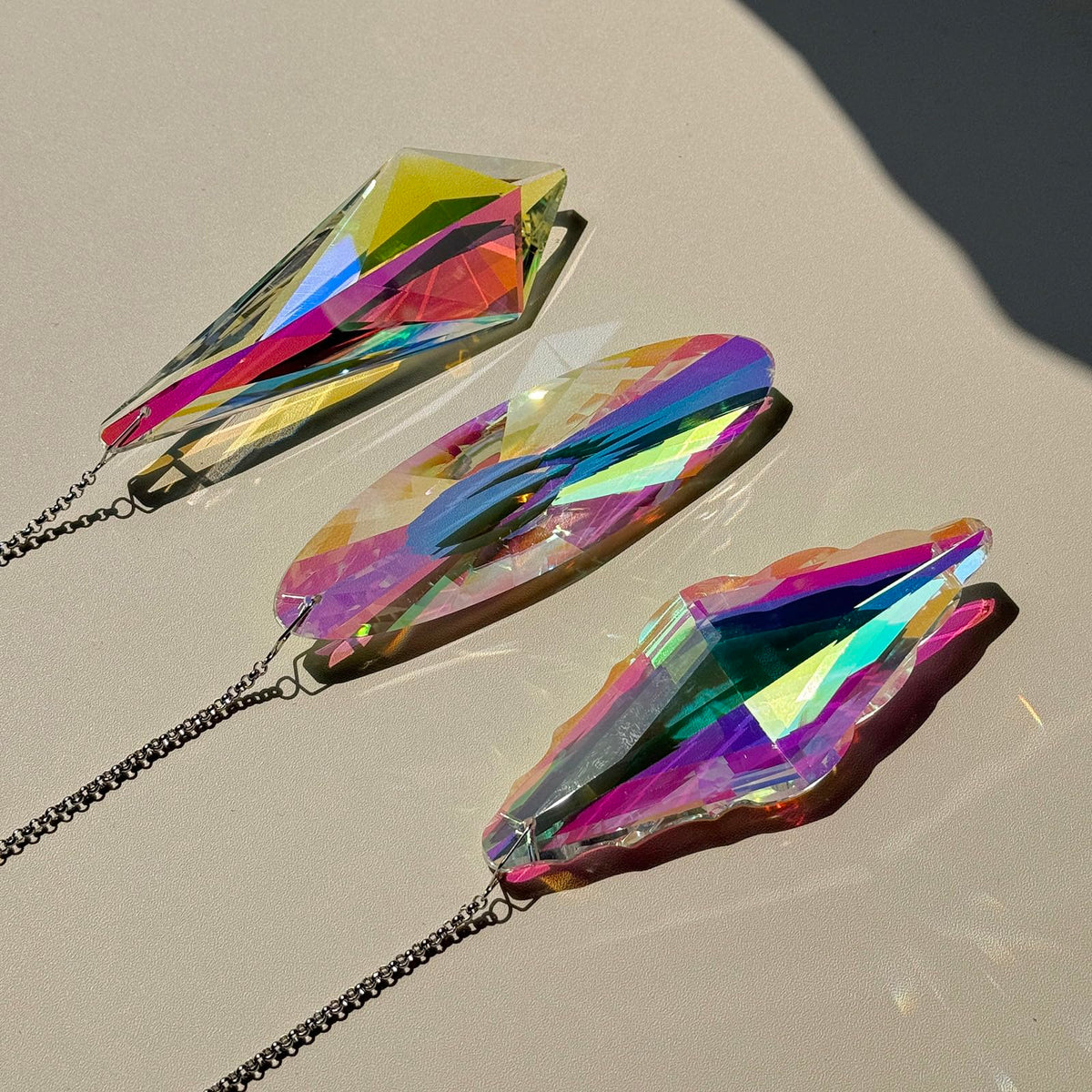 TXXNSM prism hanging ornament displays rainbow reflections in daylight