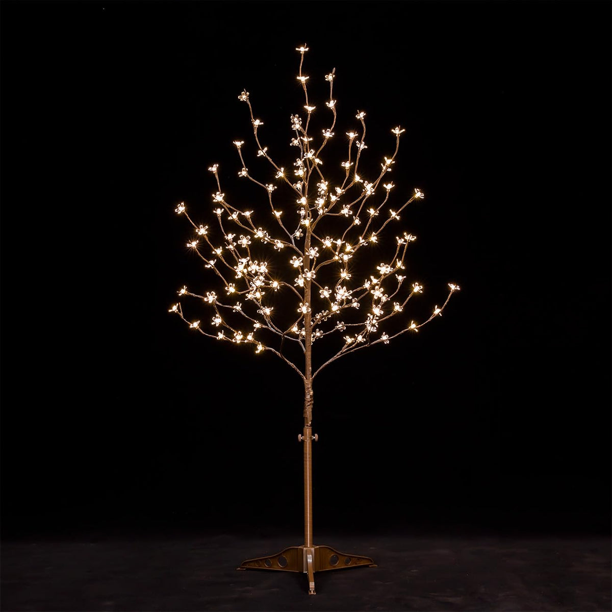 TYBEEU 4ft cherry blossom tree glowing with warm LEDs for versatile decor.
