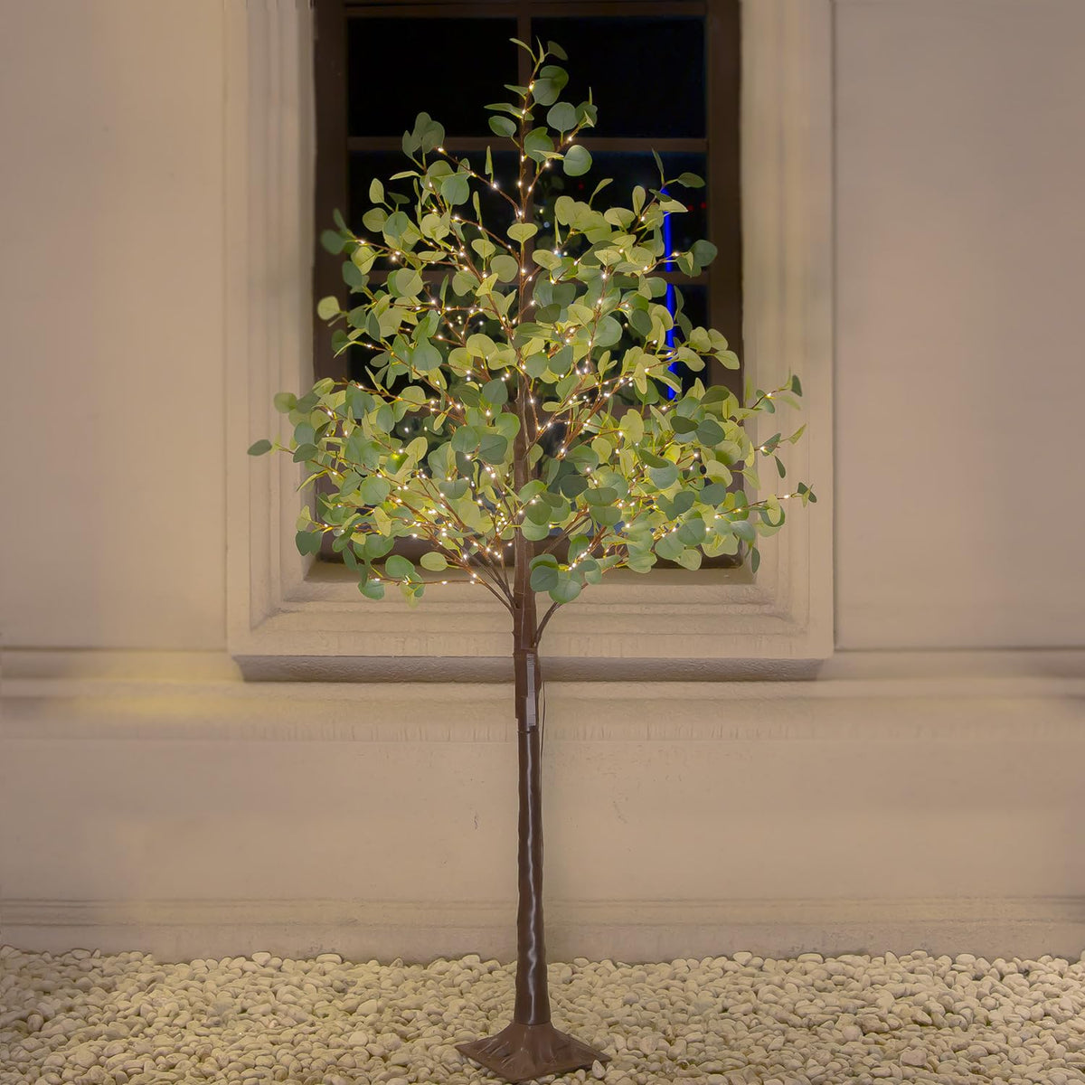 TYBEEU 6ft lighted eucalyptus tree with warm LEDs for cozy indoor ambiance.