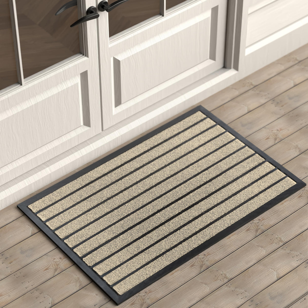 ubdyo dirt-trapping outdoor door mat with grass and rubber strips catching mud at the threshold