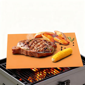 UBeesize Copper Grill Mat on grill surface prevents sticking and food loss.