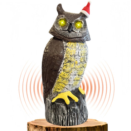 Ugold owl statue solar panel back charges outdoors in sunlight.