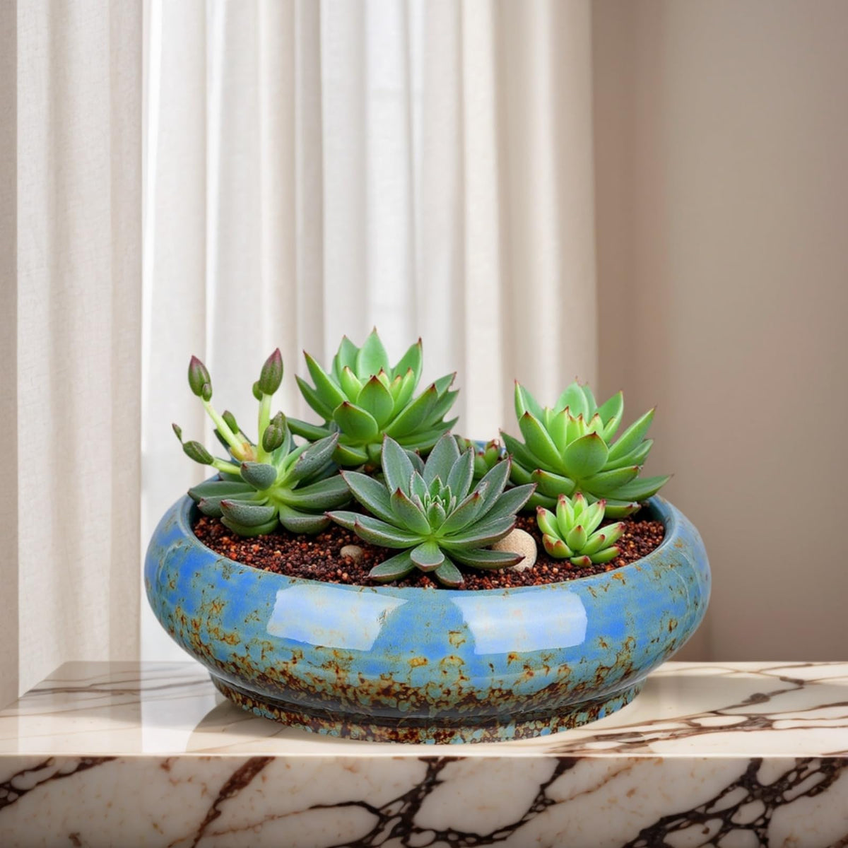 Uikherxn ceramic planter with blue glaze suits modern living rooms.