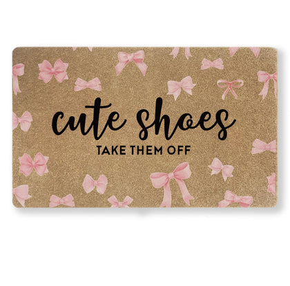 Uilatyu pink bow doormat 30x17 showing durable faux coir and welcoming design.