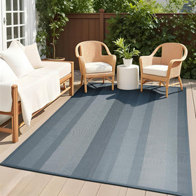 UKISS Outdoor Rug 8x10 laid flat on patio for outdoor gatherings.