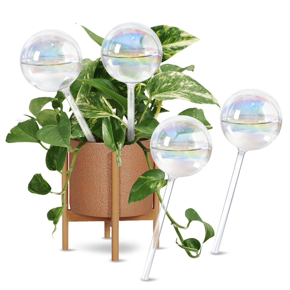 ULTRNICC self-watering globes in iridescent glass resting in a plant pot for decorative hydration.