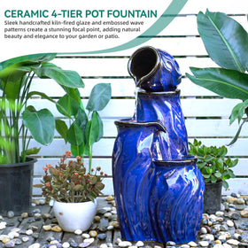 Ultym four-tier ceramic fountain illuminated by warm LEDs at night