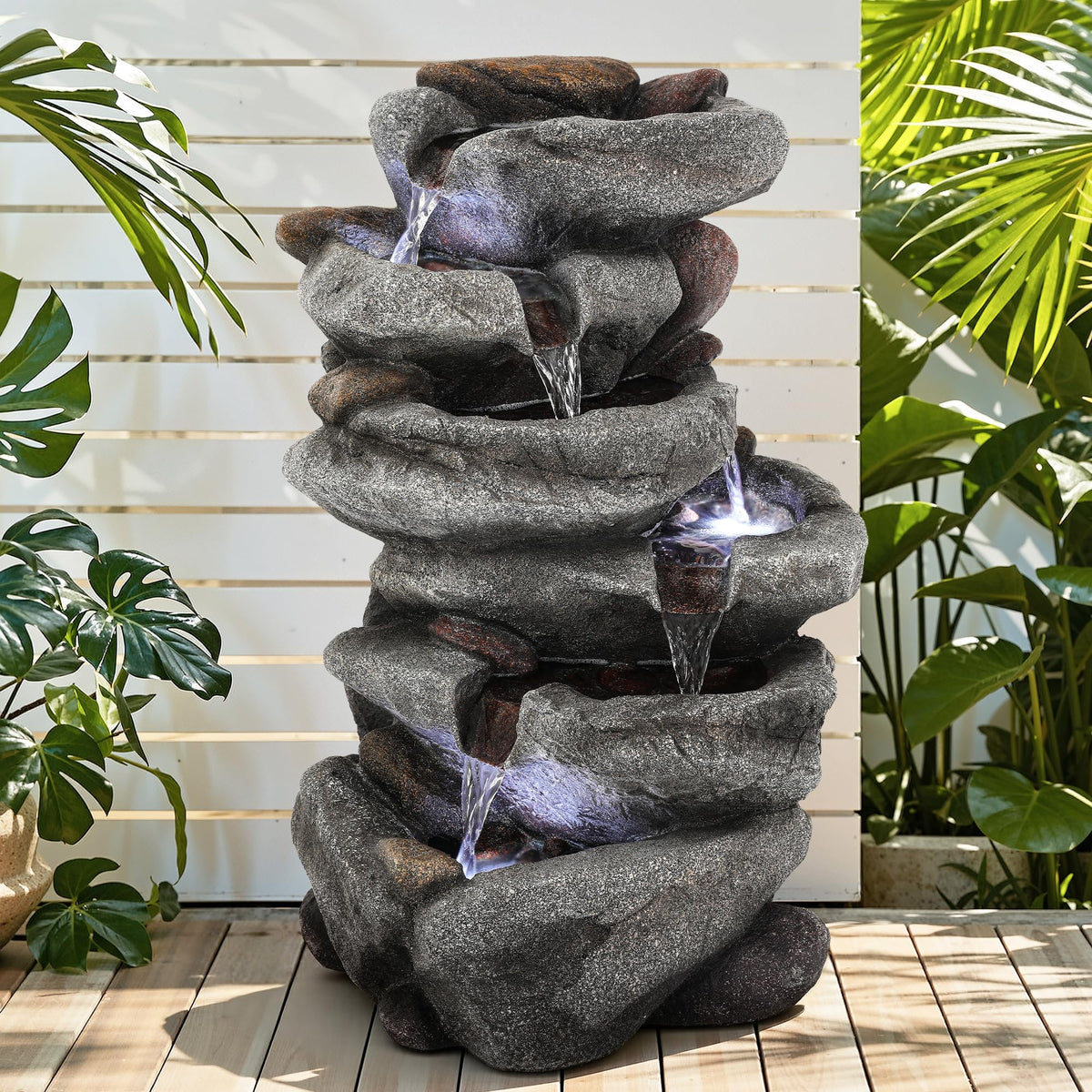 Ultym five-tier rock waterfall adds depth to patio evenings.