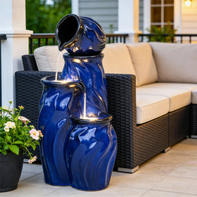 Ultym fountain with warm LED lighting enhances evening patio