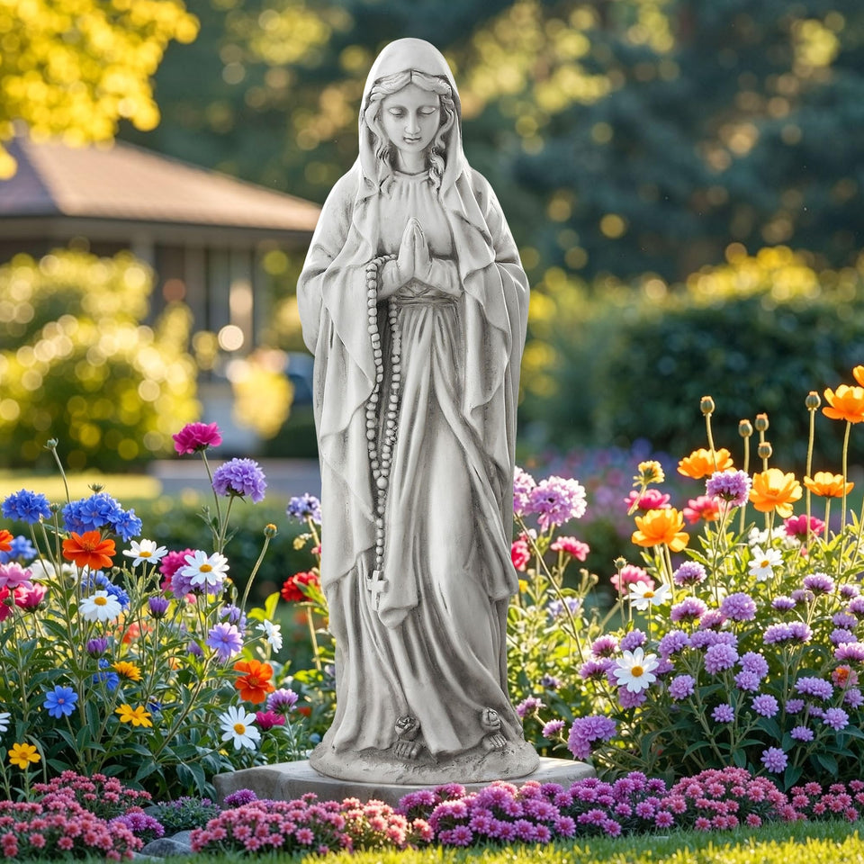 Ultym Virgin Mary praying statue outdoors serves as a garden focal point.
