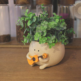 UMESONG resin head planter for indoor gardens and outdoor patios.