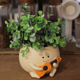 UMESONG Smily Face Planter with drainage holes for indoor or outdoor use.