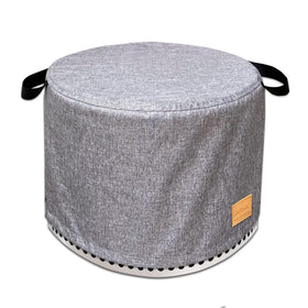 UNARK round fire pit cover on patio protecting a 22 inch diameter pit
