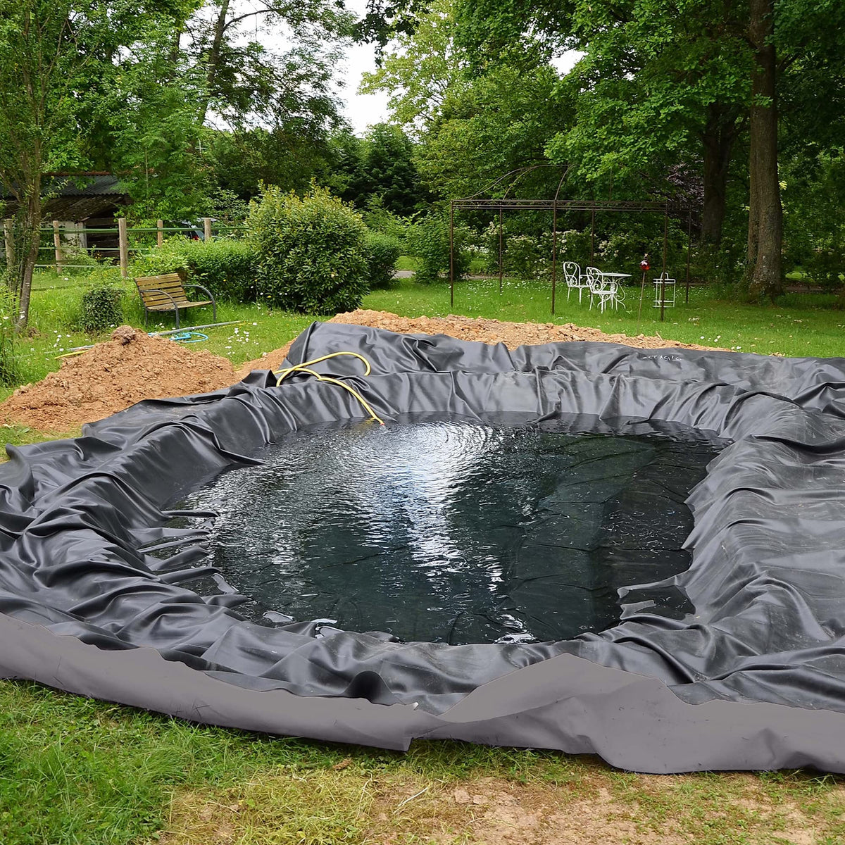 UNDERGUARD weed barrier geotextile protects beds while allowing water drainage.