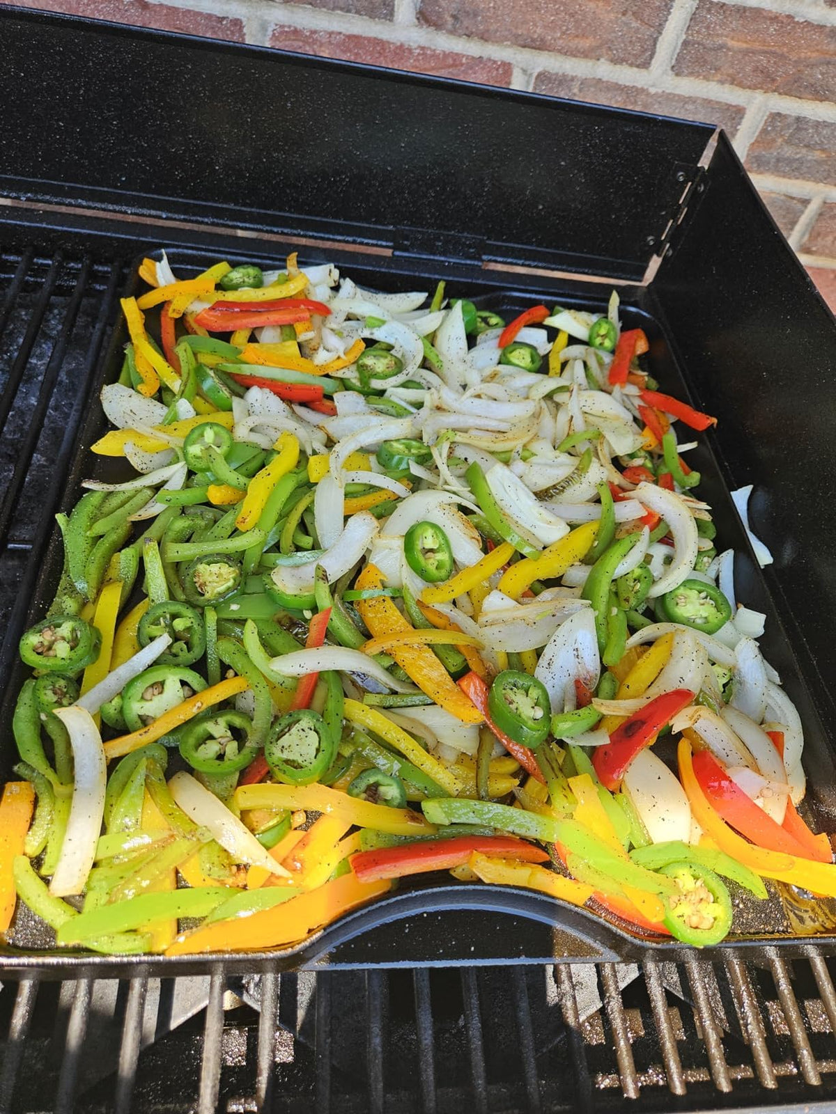 Uniflasy cast iron griddle on Camp Chef stove shows outdoor compatibility