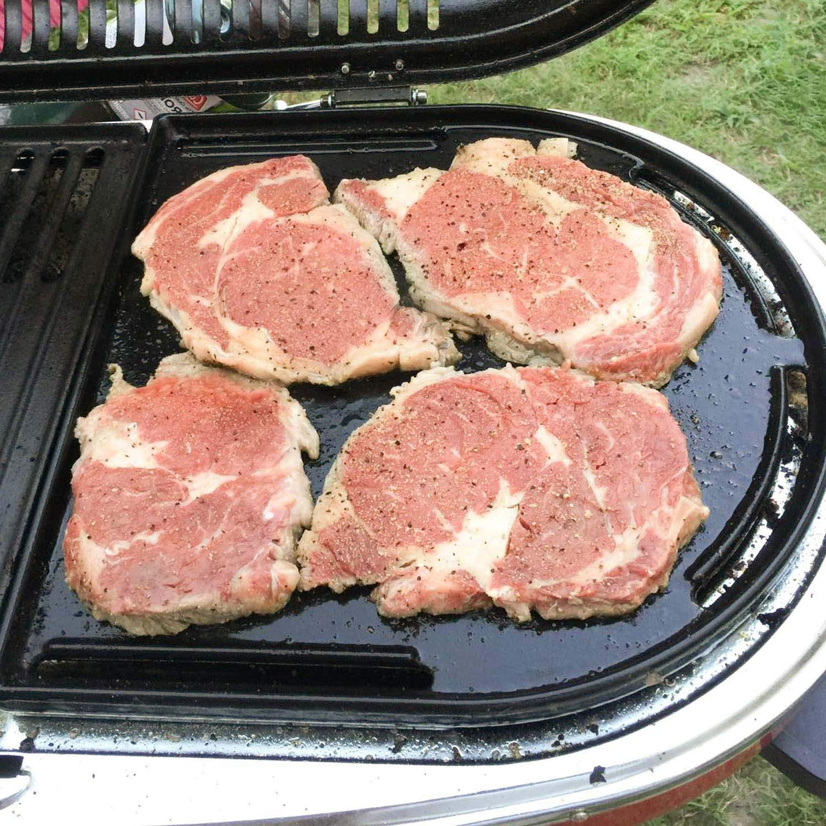 Uniflasy half-grill features a lip edge to keep foods from slipping during cooking