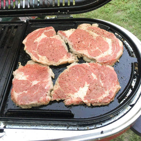 Uniflasy half-grill features a lip edge to keep foods from slipping during cooking