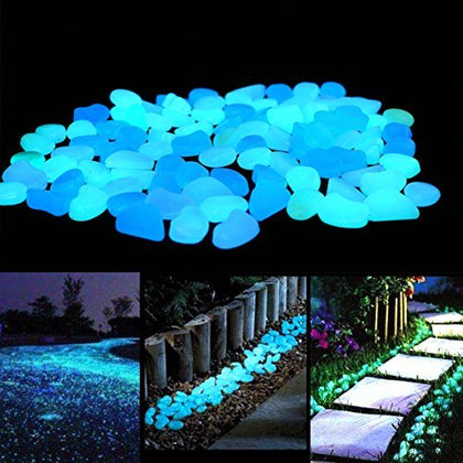 Unime glow-in-the-dark garden pebbles illuminate a garden path with blue glow for safer night walking