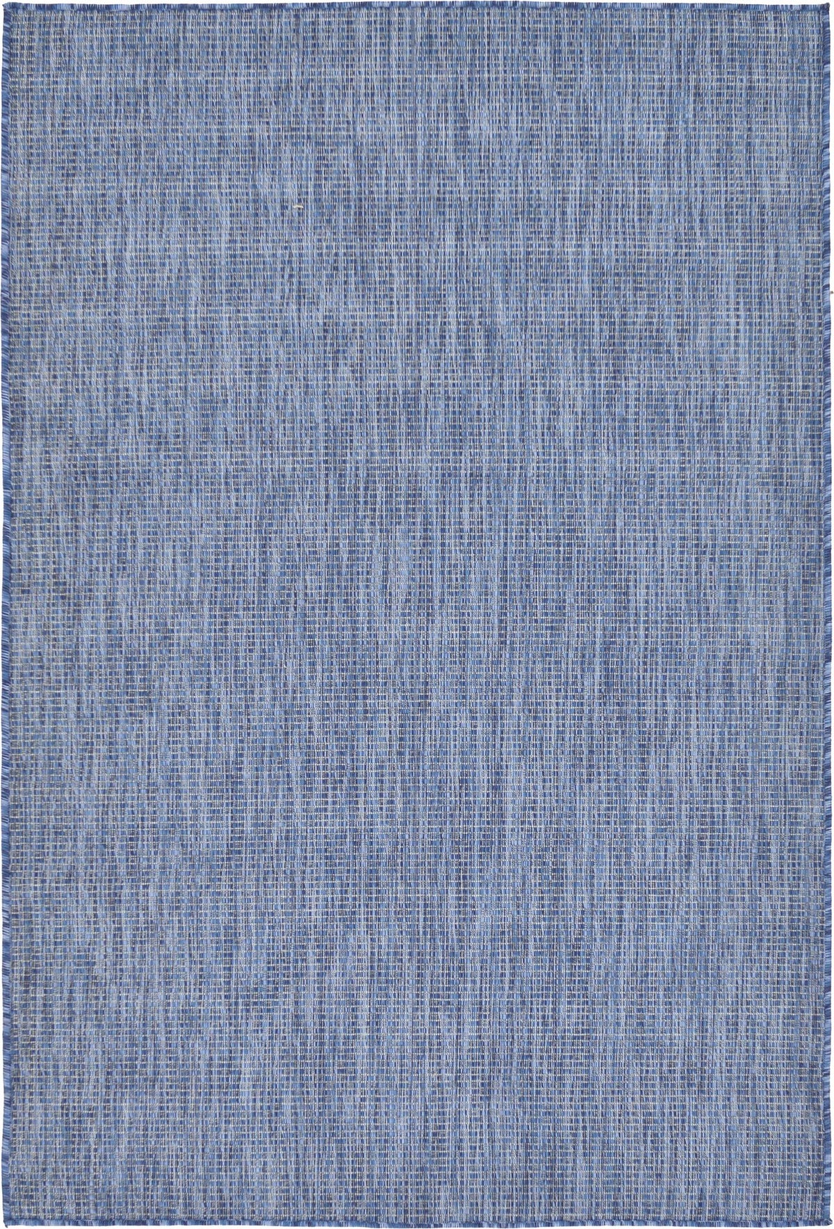 Unique Loom collection rug in blue navy in living room setup for versatile indoor-outdoor use.