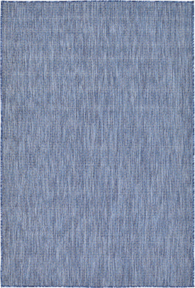 Unique Loom collection rug in blue navy in living room setup for versatile indoor-outdoor use.