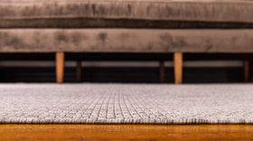 Unique Loom outdoor-ready flatweave rug in beige ivory, ideal for patios.