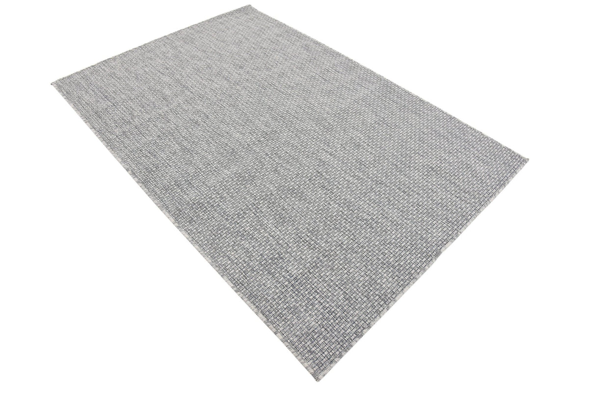Unique Loom indoor-outdoor rug emphasizes durability in high-traffic areas.