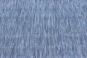 Unique Loom indoor-outdoor rug on deck with low pile keeps dirt away.
