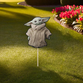 Unique outdoor decor featuring The Child cardboard sign for versatile use