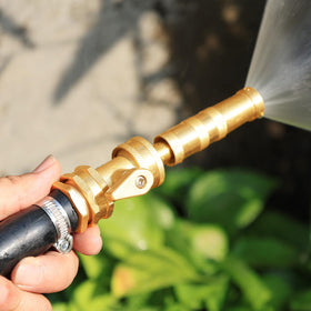 Outdoor garden scene with UNWAVER valve, showing versatile hose-end use.