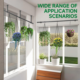Uoveya indoor greenery on a rod shelf brightens a living room.