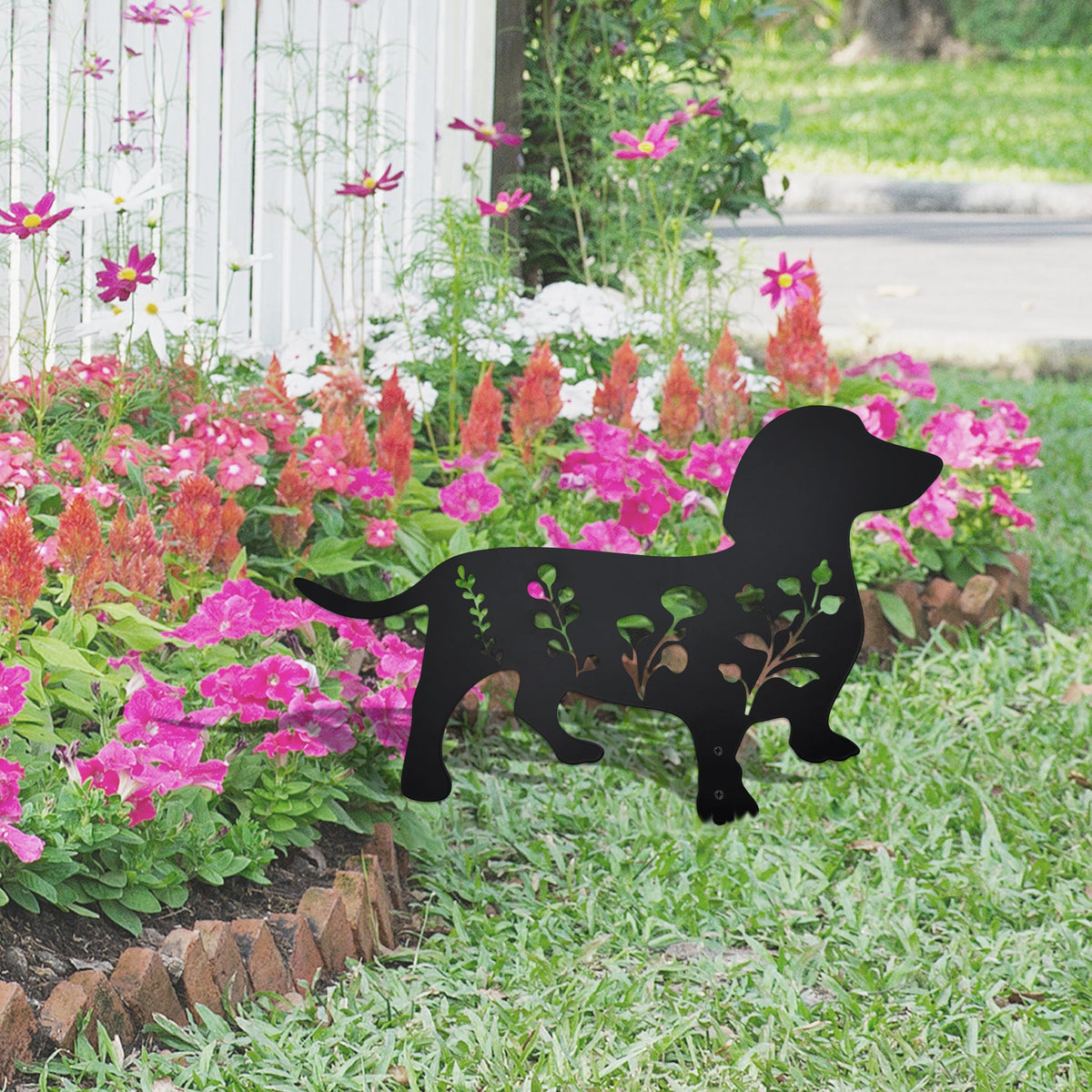 Urbraneco stable soil stake keeps the dachshund sculpture securely in place along paths.