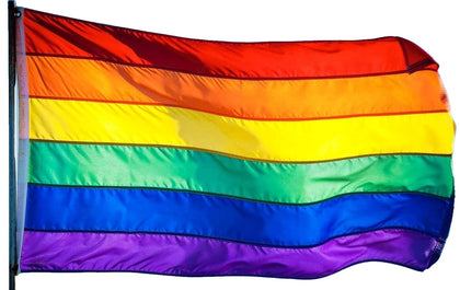US Flag Factory rainbow flag with sewn stripes displayed outdoors