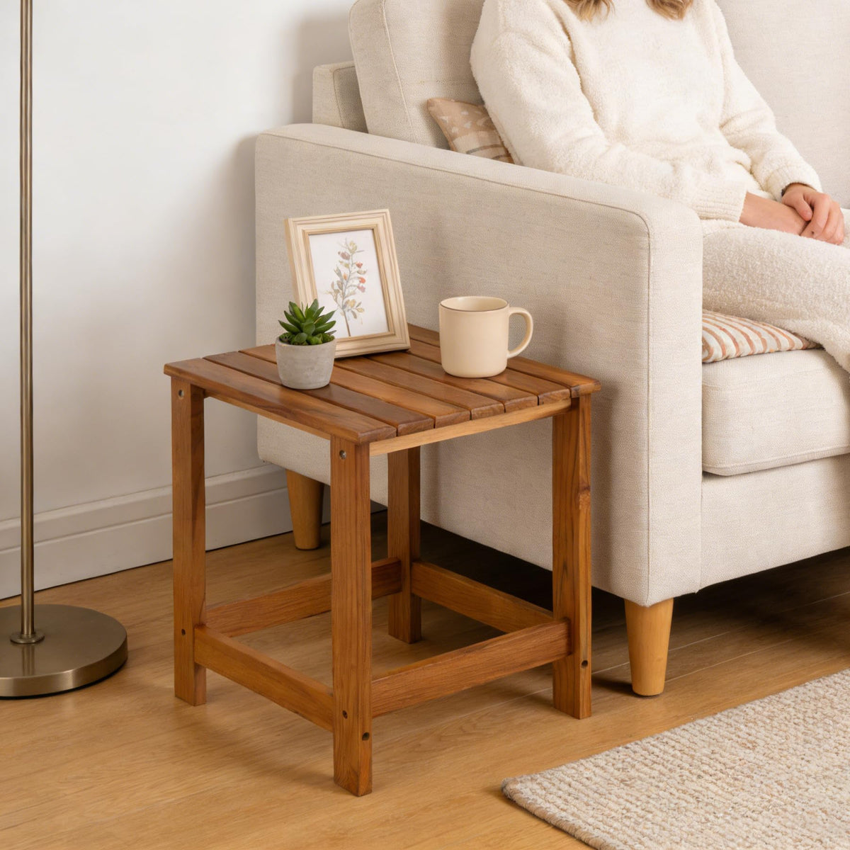 Utoplike teak outdoor side table is multi-use for drinks, plants, or decor