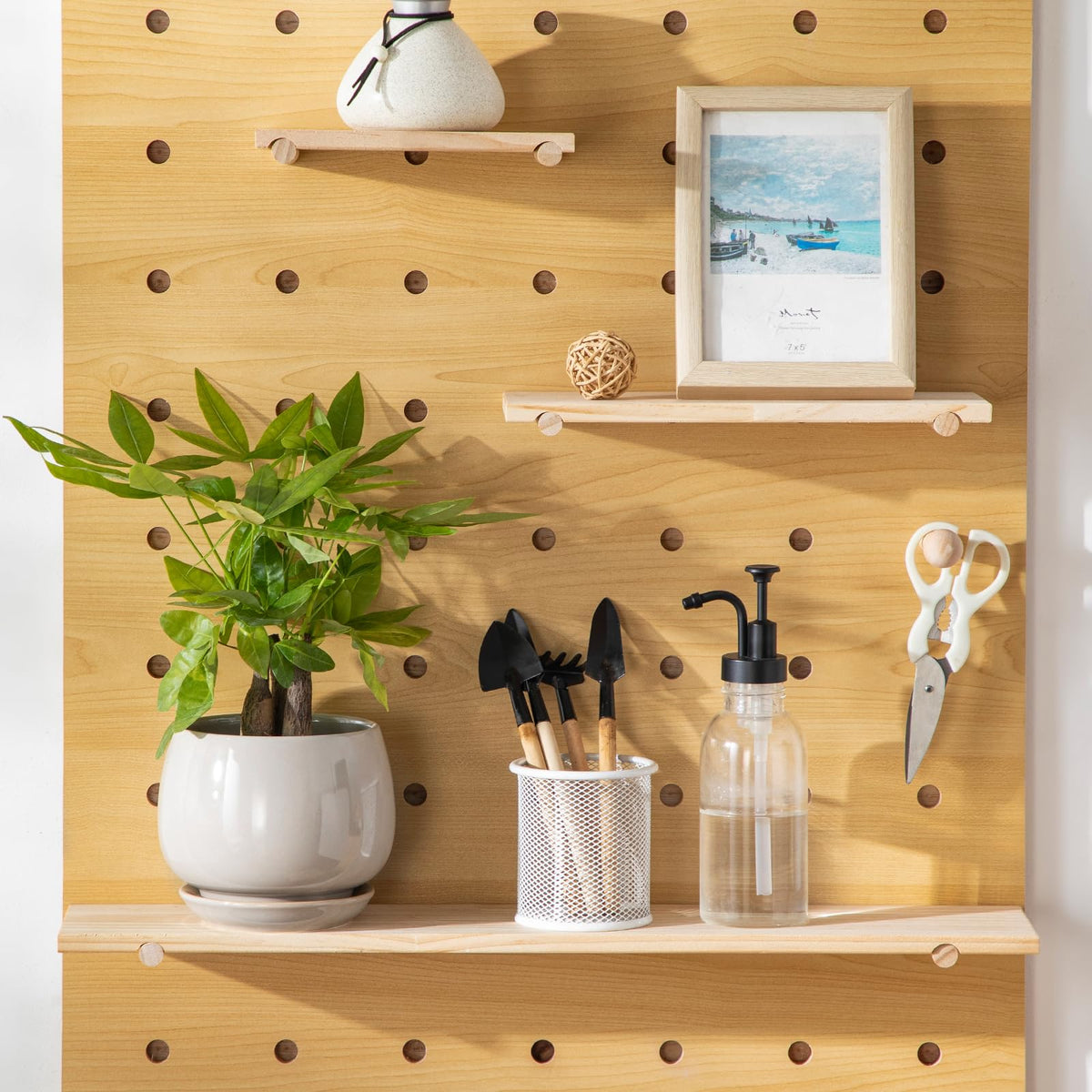 Vancasso cohesive display gray pots organized on shelves