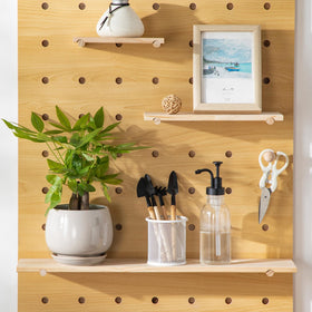 Vancasso cohesive display gray pots organized on shelves