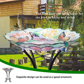 VCUTEKA glass birdbath on metal stand provides stable outdoor display.