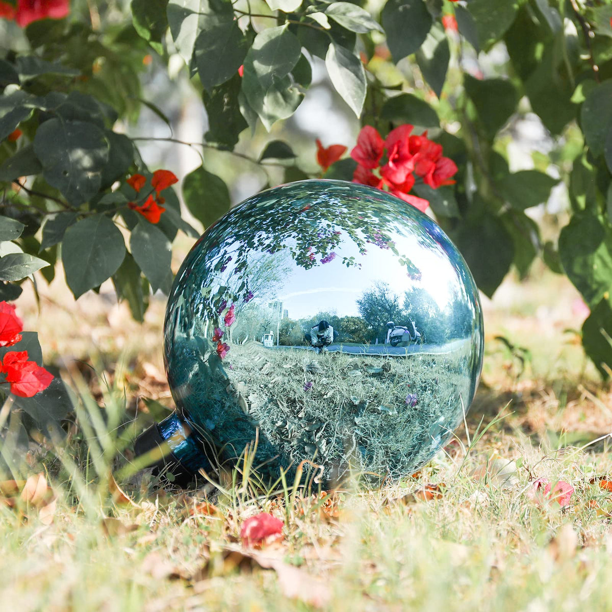 VCUTEKA 10-inch blue gazing ball enhances lawn with subtle sparkle.