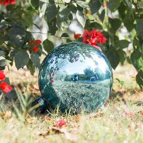 VCUTEKA 10-inch blue gazing ball enhances lawn with subtle sparkle.