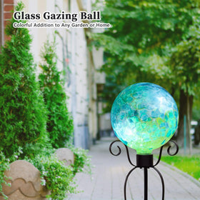 VCUTEKA glass garden ball in blue swirl adds a colorful focal point