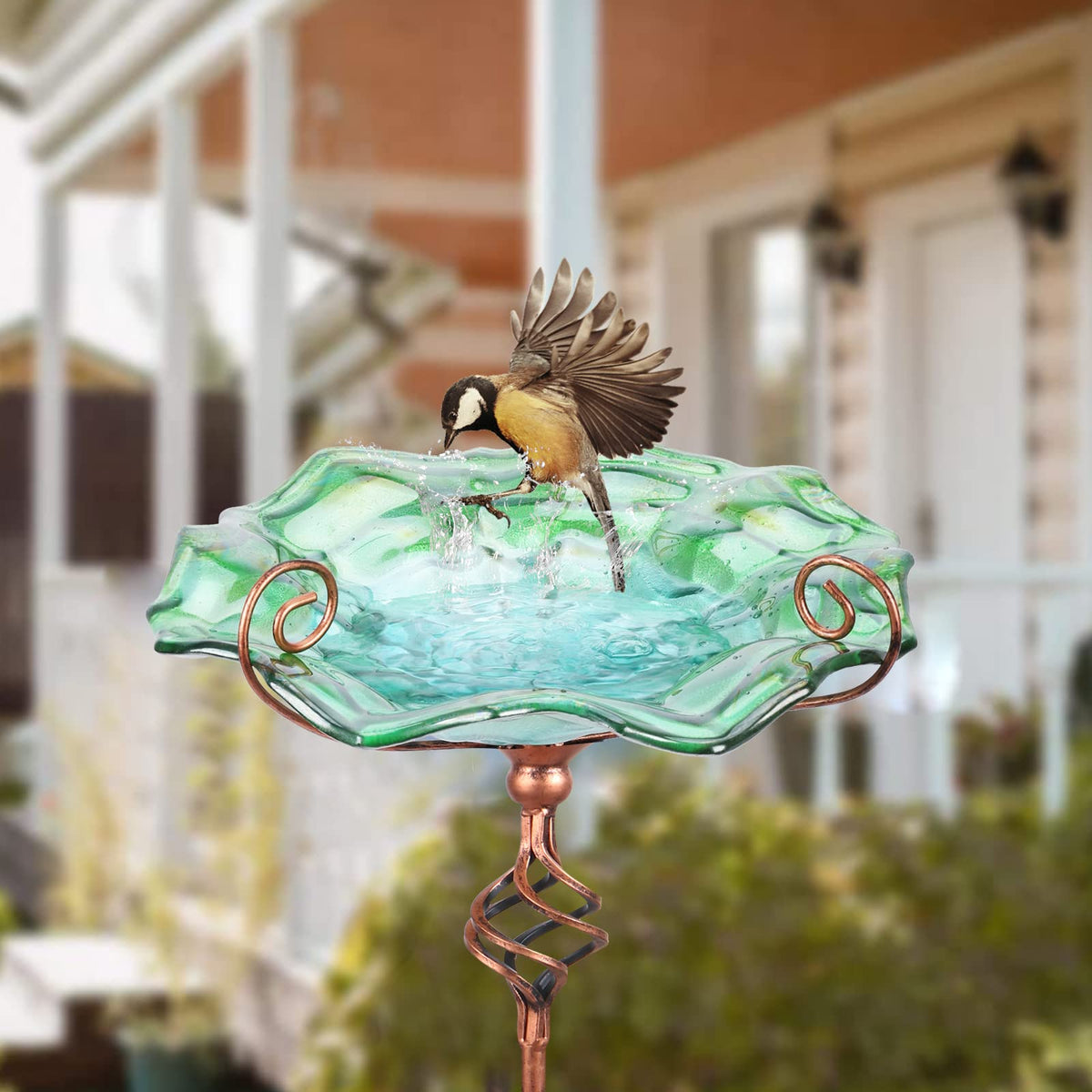 Glass flower design bowl and stainless stem add color and stability to your garden.